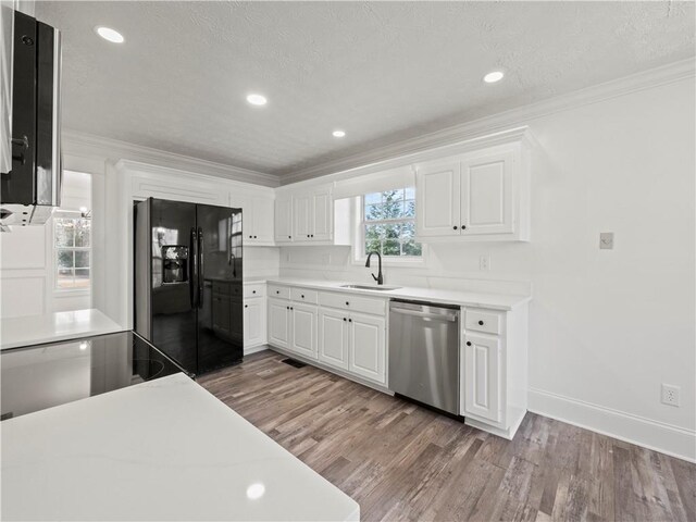 6333 Horizon Dr, Flowery Branch, GA 30542 - unfurnished living room featuring wood finished floors, a chandelier, crown molding, beam ceiling, and a fireplace
