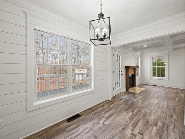 6333 Horizon Dr, Flowery Branch, GA 30542 - unfurnished living room featuring wood finished floors, a chandelier, crown molding, beam ceiling, and baseboards