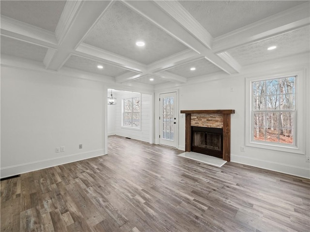 6333 Horizon Dr, Flowery Branch, GA 30542 - unfurnished living room featuring healthy amount of natural light, a fireplace with flush hearth, coffered ceiling, beamed ceiling, and baseboards