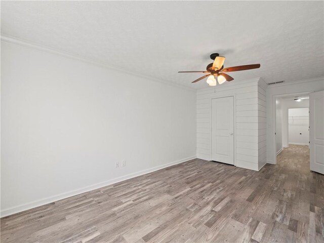 6333 Horizon Dr, Flowery Branch, GA 30542 - unfurnished bedroom featuring wood finished floors, crown molding, baseboards, and ceiling fan