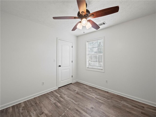 6333 Horizon Dr, Flowery Branch, GA 30542 - unfurnished room with wood finished floors, a ceiling fan, and baseboards