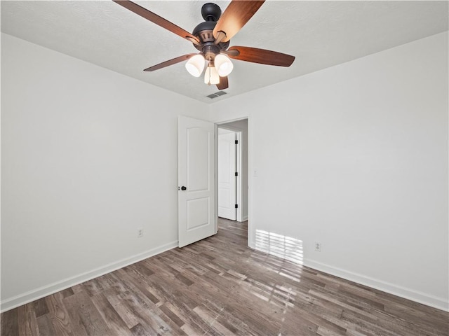 6333 Horizon Dr, Flowery Branch, GA 30542 - empty room with wood finished floors, ceiling fan, and baseboards