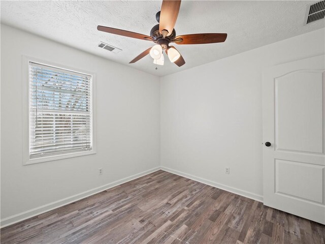 6333 Horizon Dr, Flowery Branch, GA 30542 - empty room featuring ceiling fan, dark wood finished floors, baseboards, and a textured ceiling