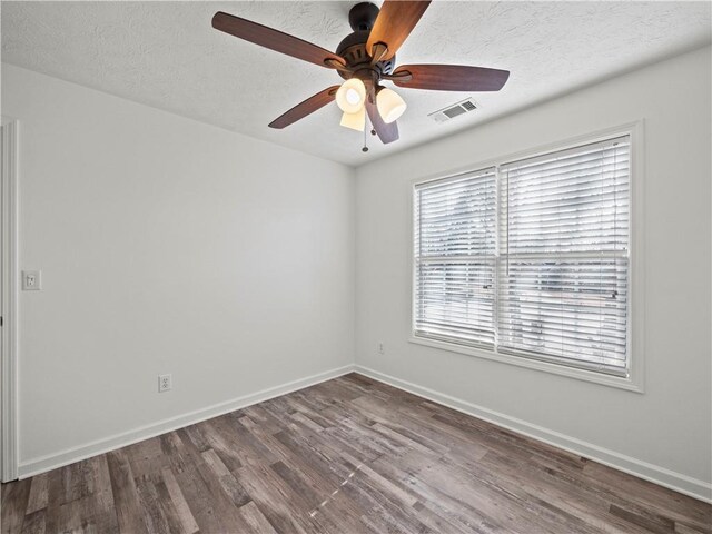 6333 Horizon Dr, Flowery Branch, GA 30542 - spare room featuring a ceiling fan, dark wood-type flooring, baseboards, and a textured ceiling