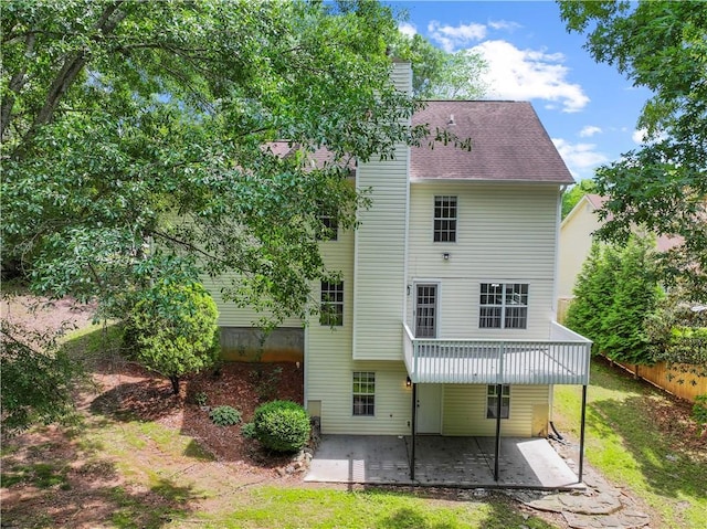 6333 Horizon Dr, Flowery Branch, GA 30542 - rear view of property featuring a patio area, a lawn, a chimney, and roof with shingles