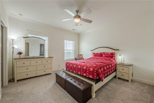 bedroom featuring ornamental molding, baseboards, and carpet floors