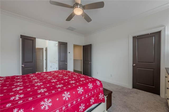 carpeted bedroom with visible vents, a ceiling fan, connected bathroom, crown molding, and baseboards