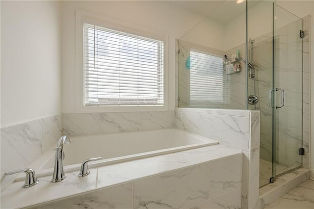 bathroom with a bath, marble finish floor, and a marble finish shower