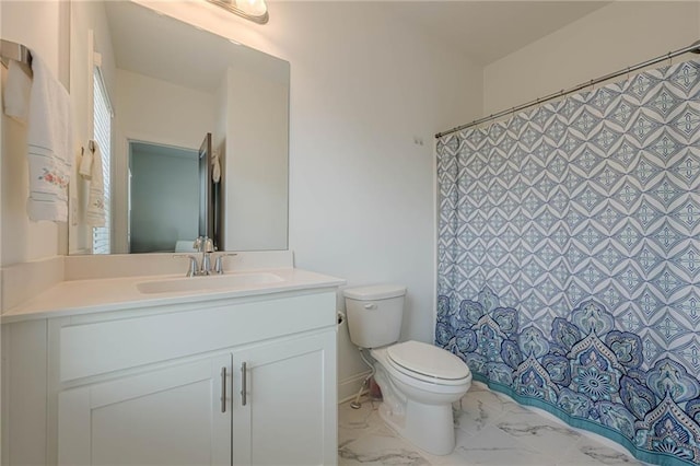 bathroom with vanity, a shower with shower curtain, toilet, and marble finish floor