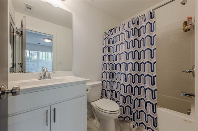 bathroom featuring visible vents, toilet, vanity, and shower / tub combo