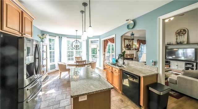 9742 Fallview Ct, Villa Rica, GA 30180 - kitchen featuring stainless steel refrigerator with ice dispenser, a sink, dishwasher, light stone counters, and a center island