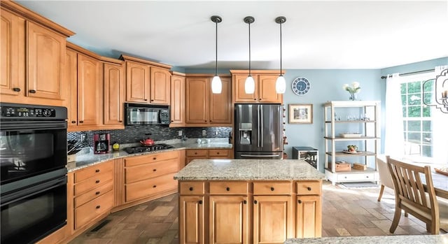 9742 Fallview Ct, Villa Rica, GA 30180 - kitchen with black appliances, decorative backsplash, light stone counters, pendant lighting, and a center island