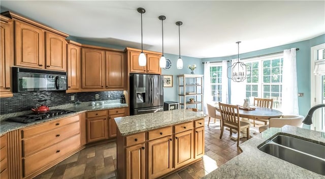 9742 Fallview Ct, Villa Rica, GA 30180 - kitchen featuring black microwave, stainless steel refrigerator with ice dispenser, gas cooktop, a sink, and tasteful backsplash