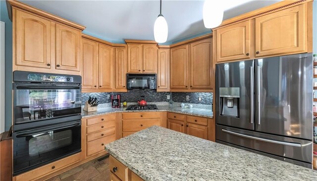9742 Fallview Ct, Villa Rica, GA 30180 - kitchen featuring black appliances, light stone countertops, decorative backsplash, dark stone finish floors, and decorative light fixtures