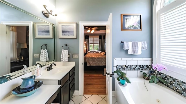 9742 Fallview Ct, Villa Rica, GA 30180 - full bath featuring ensuite bathroom, a garden tub, tile patterned flooring, vanity, and a ceiling fan