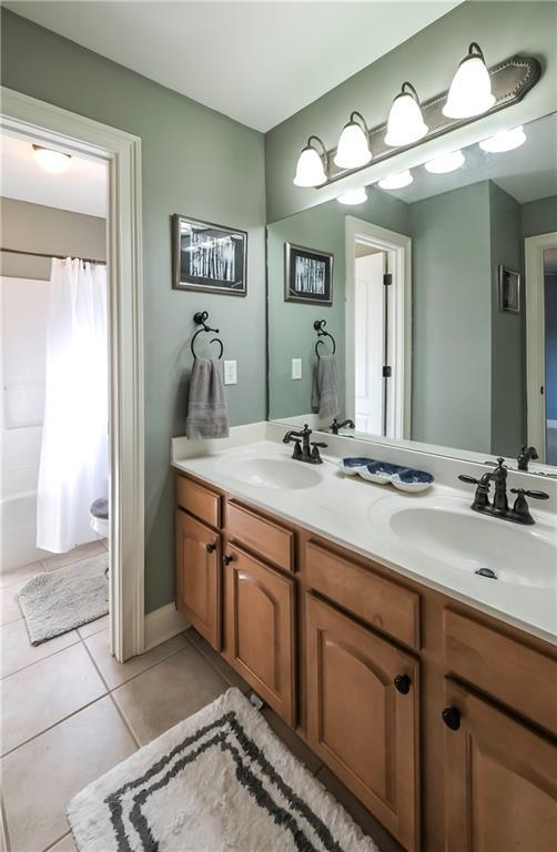 9742 Fallview Ct, Villa Rica, GA 30180 - full bath with tile patterned flooring and double vanity