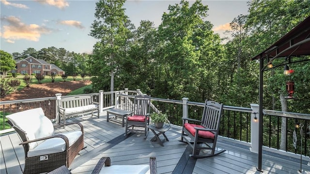 9742 Fallview Ct, Villa Rica, GA 30180 - deck at dusk with view of scattered trees