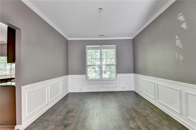 empty room featuring crown molding and dark hardwood / wood-style floors