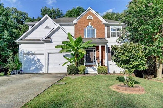 view of front facade featuring driveway, a front yard, a garage, and brick siding