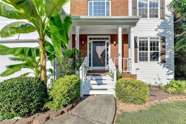 entrance to property with a porch