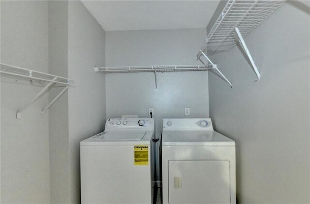 washroom with separate washer and dryer