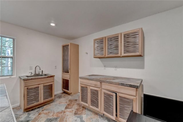 kitchen with light tile patterned floors and sink