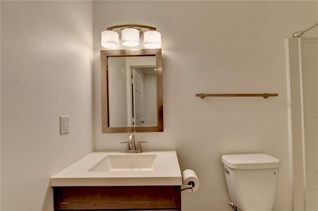 bathroom with toilet and vanity