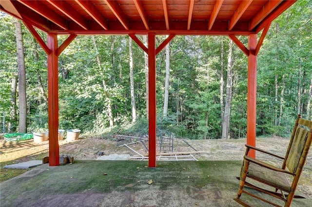 view of patio / terrace featuring a forest view