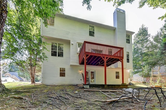 rear view of house featuring a balcony