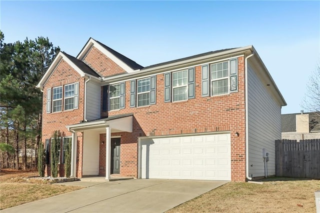 view of front of property with a front yard and a garage