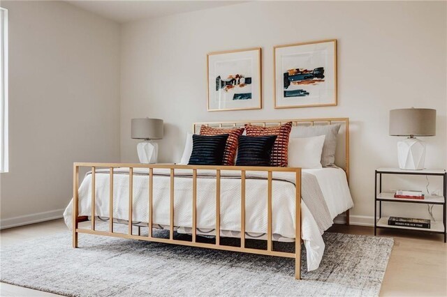 bedroom featuring wood-type flooring