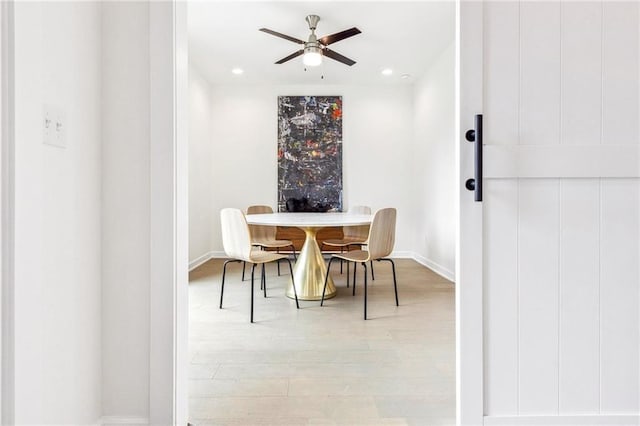 dining area featuring ceiling fan and light hardwood / wood-style floors