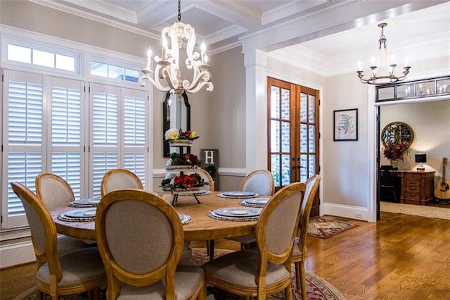 dining space featuring a chandelier, french doors, ornamental molding, wood finished floors, and beamed ceiling