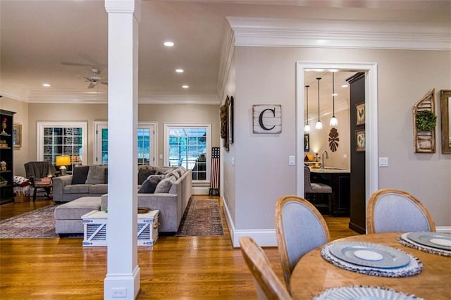 dining room featuring a ceiling fan, wood finished floors, recessed lighting, ornamental molding, and baseboards