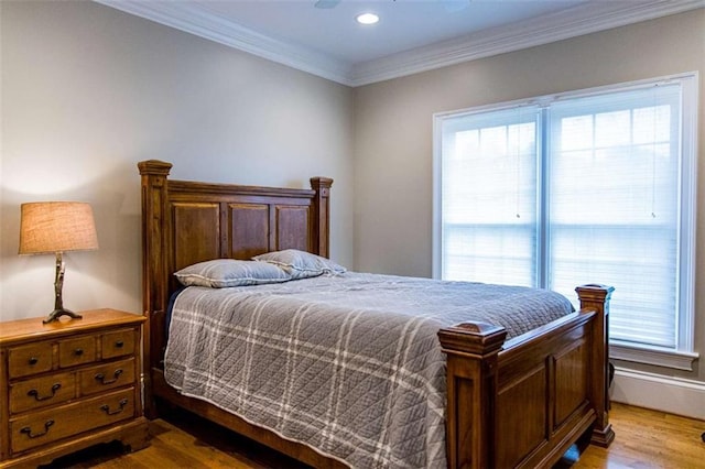 bedroom featuring multiple windows, wood finished floors, ornamental molding, recessed lighting, and ceiling fan