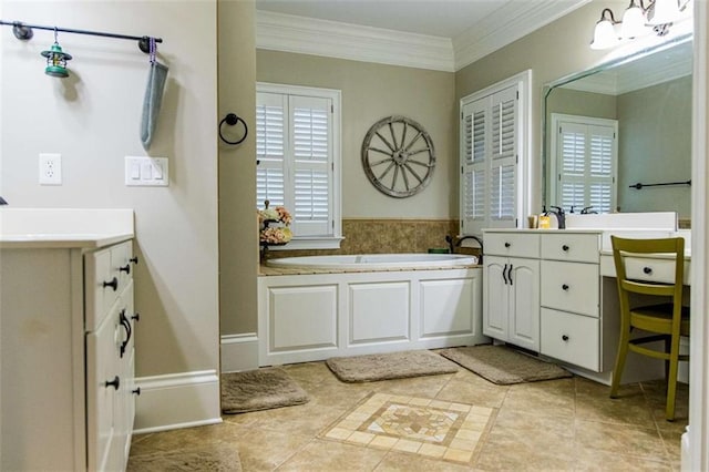 bathroom featuring vanity, plenty of natural light, ornamental molding, and a garden tub