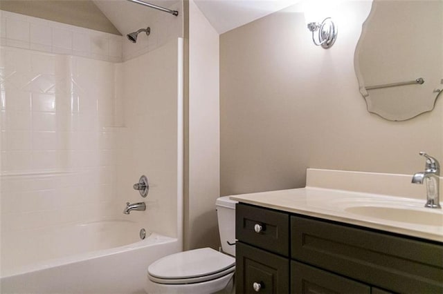 full bath featuring toilet, washtub / shower combination, vanity, and lofted ceiling