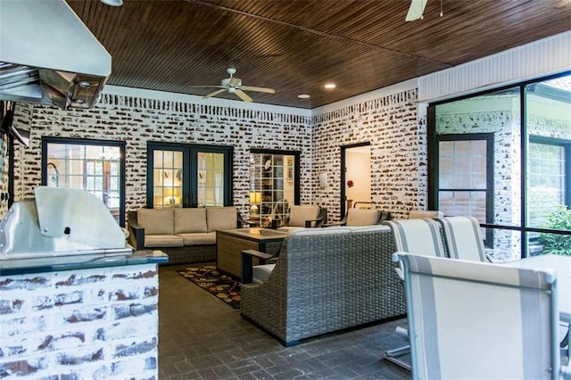 view of patio / terrace with ceiling fan, outdoor lounge area, an outdoor kitchen, and a grill