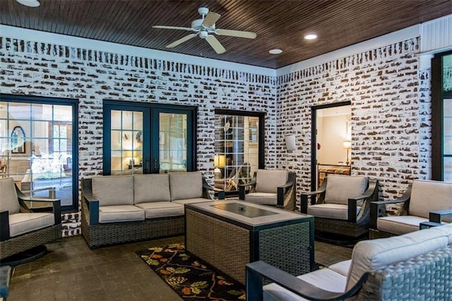 living area featuring a ceiling fan, brick patterned flooring, french doors, and recessed lighting
