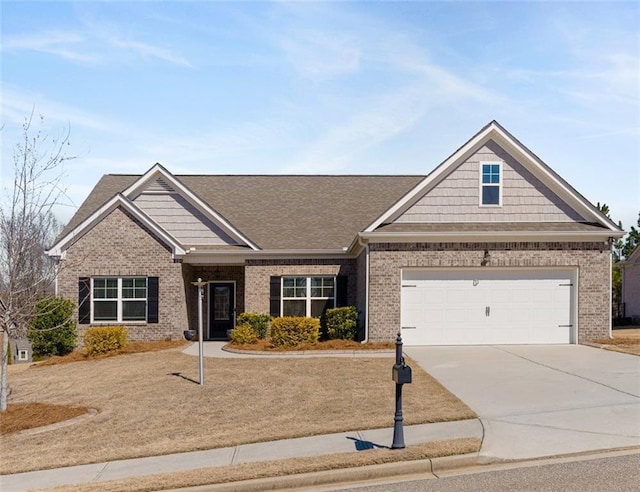 craftsman-style home featuring driveway and brick siding