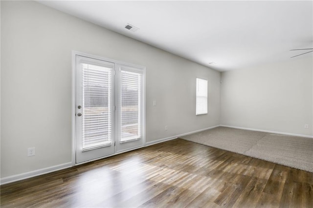 spare room with wood-type flooring