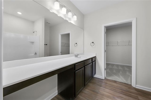 bathroom with vanity and hardwood / wood-style flooring