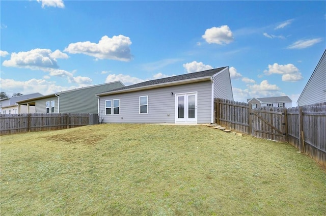 rear view of house with a yard and central air condition unit