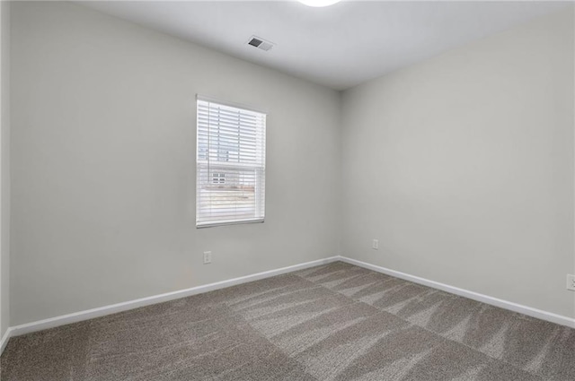 spare room with carpet floors