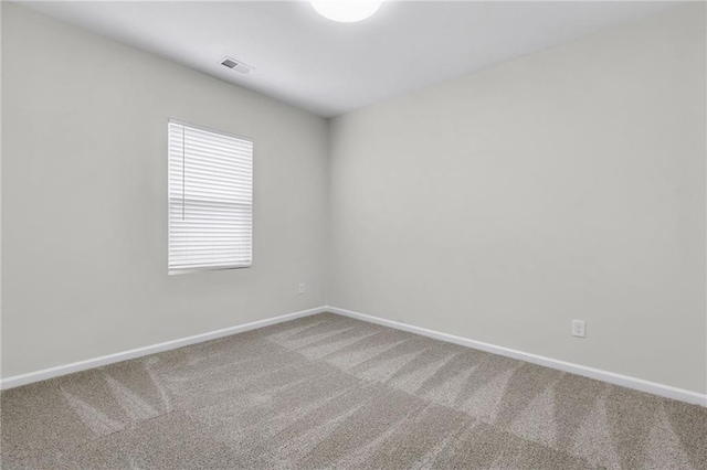 unfurnished room with carpet flooring