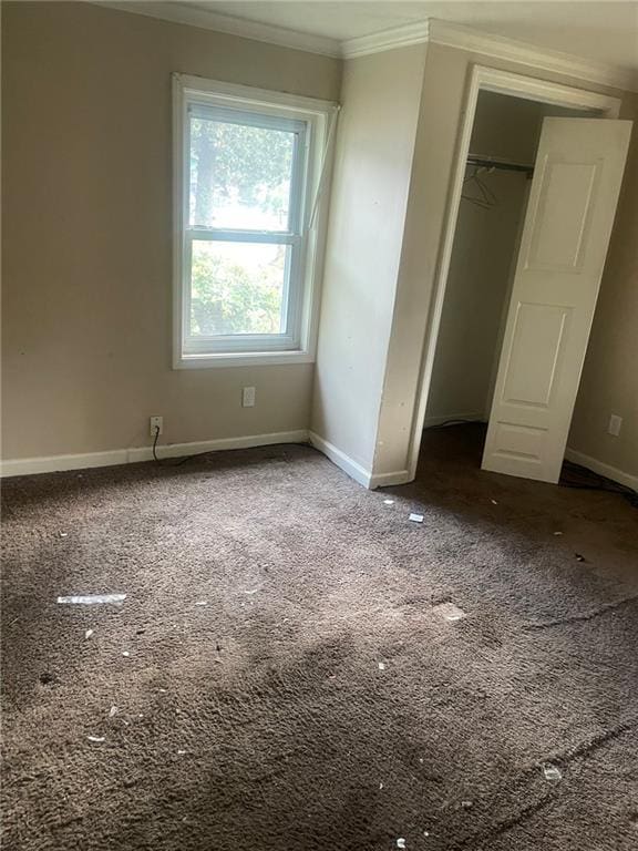 914 Bowden St, Savannah, GA 31415 - unfurnished bedroom with ornamental molding, carpet floors, baseboards, and a closet