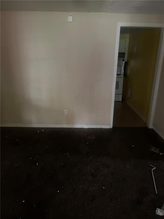 914 Bowden St, Savannah, GA 31415 - empty room with baseboards and concrete flooring