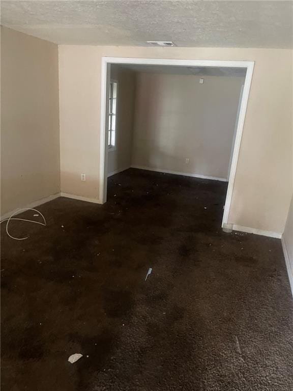 914 Bowden St, Savannah, GA 31415 - spare room featuring baseboards and a textured ceiling