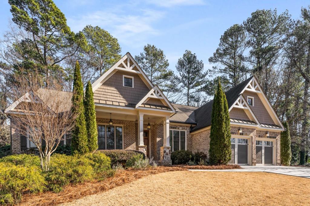 craftsman-style home featuring a porch and a garage