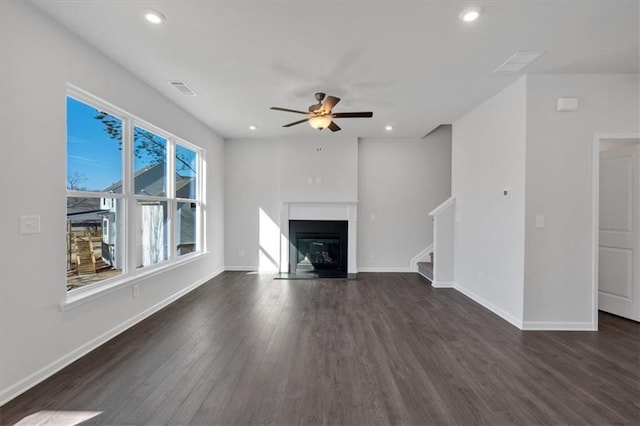 14 Grove Pointe Way SE, Cartersville, GA 30120 - unfurnished living room with visible vents, baseboards, and dark wood-style flooring